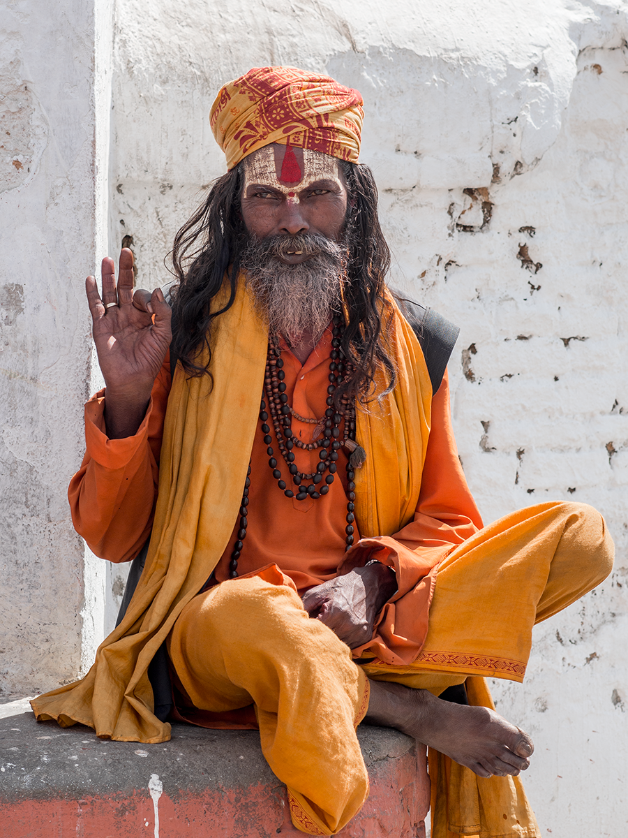 A sadhu is a religious ascetic in Hinduism.Their coloured clothes symbolise renunciation.